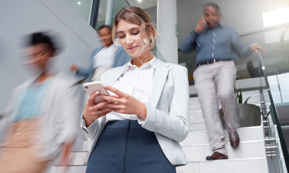 woman walking on stairs with phone 